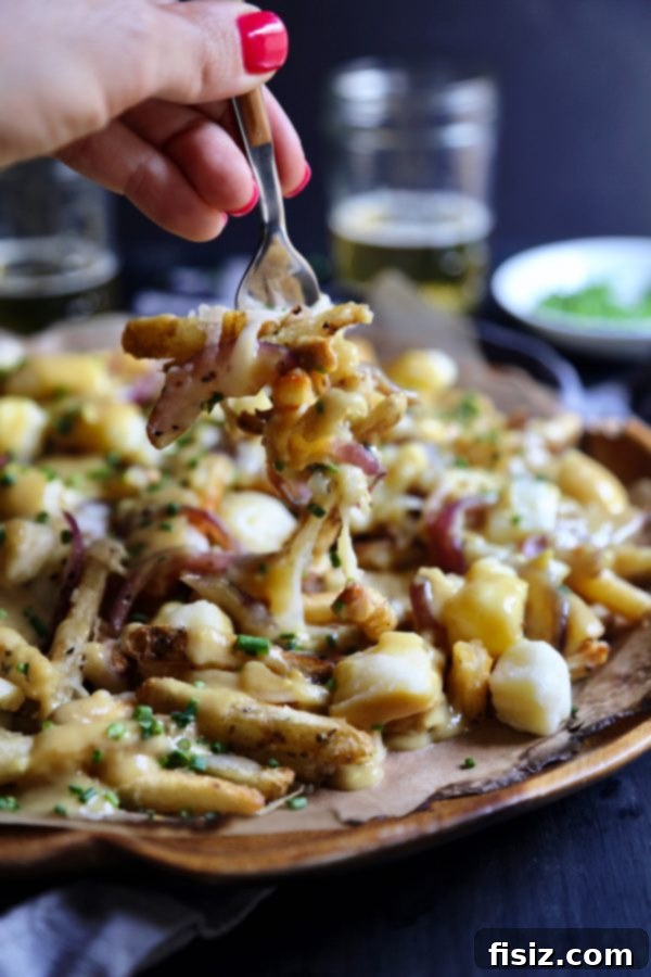 Aromatic Ginger Curry Poutine 7 A generous serving of Ginger Curry Poutine, perfect for sharing or a hearty meal
