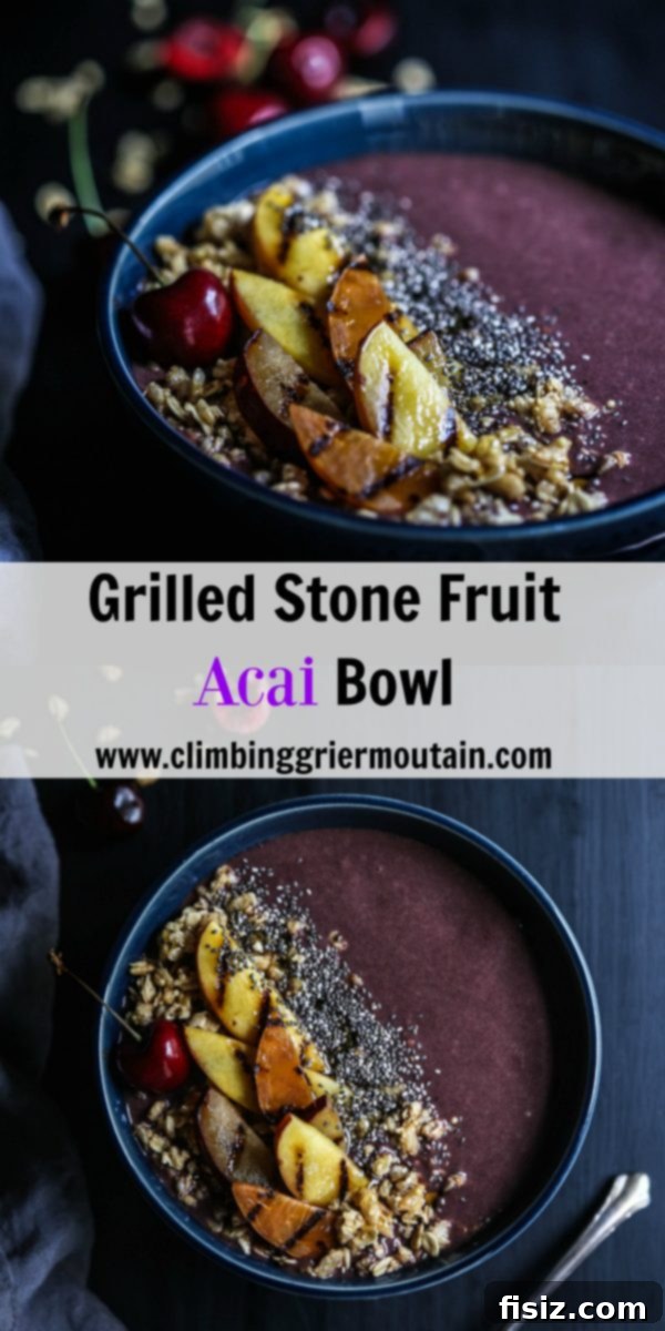 Beautifully arranged Grilled Stone Fruit Acai Bowl with wooden spoon