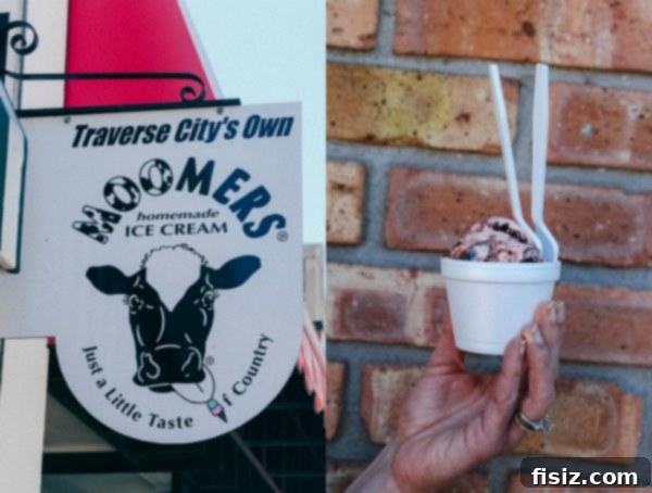Traverse City, Michigan: Your Ultimate Guide to Stays, Bites, and Sights 17 A large scoop of Moomers Homemade Ice Cream's brownie batter cherry chunk in a waffle cone