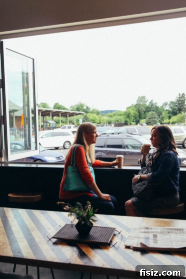 Traverse City, Michigan: Your Ultimate Guide to Stays, Bites, and Sights 18 Close-up of a handcrafted latte with intricate foam art at Black Market Coffee