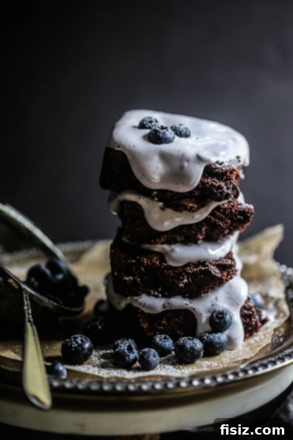 Decadent Dark Chocolate Brownies with Pillowy Blueberry Marshmallow Frosting 5 Gourmet Dark Chocolate Brownies with Blueberry Marshmallow Frosting ready to serve
