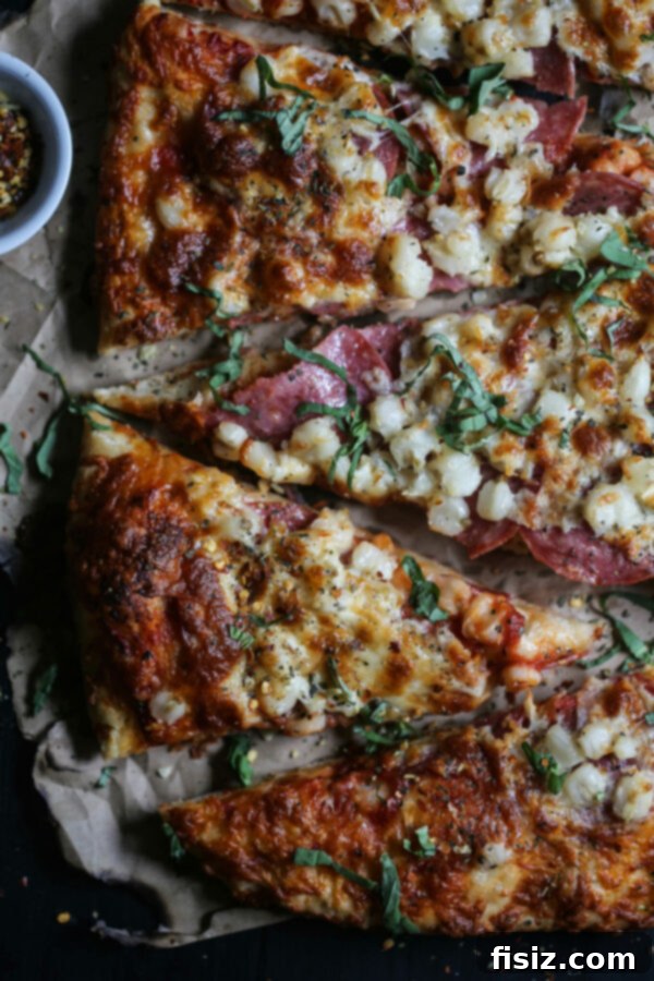 Smoked Mozzarella, Salami and Hominy Pizza 2 Delicious Salami, Hominy, and Smoked Mozzarella Pizza with a crispy crust
