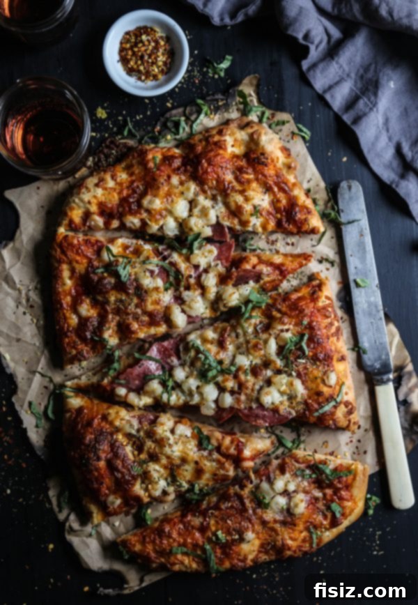 Smoked Mozzarella, Salami and Hominy Pizza 9 Full view of the Salami, Hominy, and Smoked Mozzarella Pizza, ready to be served