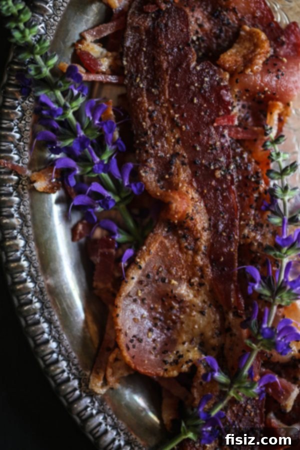 Decadent Peach and Bacon Pancakes with Lavender Butter Syrup 4 Stack of freshly cooked pancakes with a generous serving of diced peaches and crispy bacon on top.