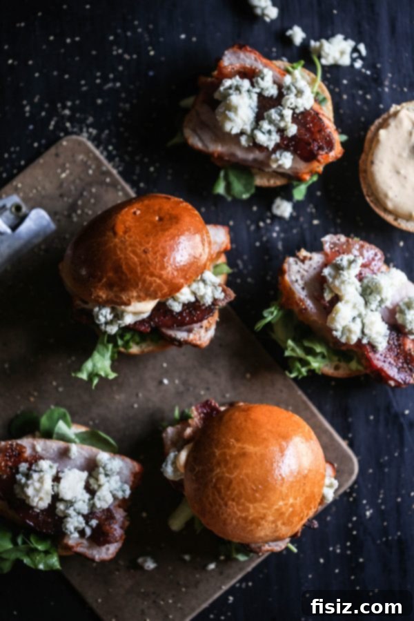 Applewood Smoked Pork Sliders with Creamy Pumpkin Aioli 6 finished applewood bacon pork loin filet sliders ready to serve