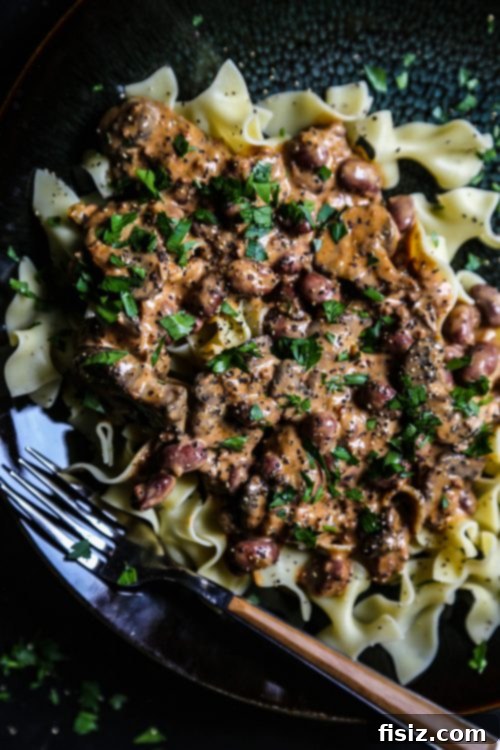 Hearty Cajun Chili Stroganoff 5 Close-up of Cajun Chili Stroganoff with sour cream drizzle