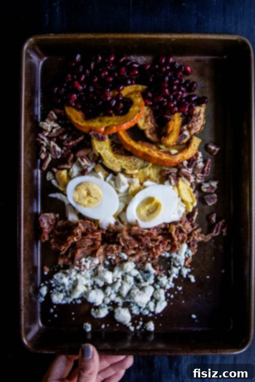 Golden Autumn Cobb: Kale, Brussels & Maple Drizzle 3 Fresh autumn ingredients for Cobb salad: kale, Brussels sprouts, roasted squash, pomegranate seeds, and hard-boiled eggs for a wholesome meal