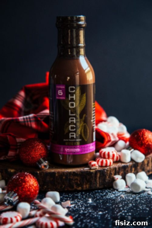 Frosted Mint Delight 4 Cholaca liquid cacao bottles displayed in a rustic setting at the Cholaca headquarters