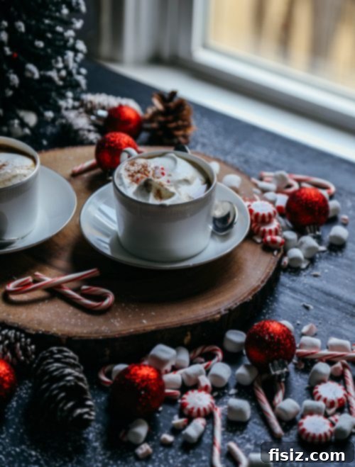 Frosted Mint Delight 5 Homemade Peppermint White Chocolate Latte garnished with a candy cane and chocolate shavings