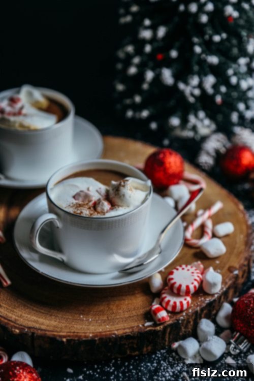 Frosted Mint Delight 6 Two mugs of Peppermint White Chocolate Latte topped with whipped cream and crushed candy canes