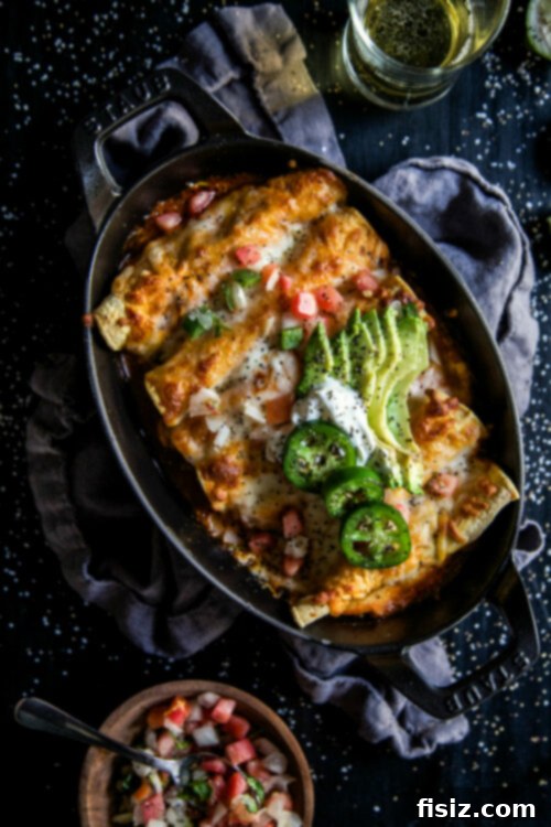 Braised Short Rib and Cheese Taquitos 2 Cheesy Short Rib Stuffed Taquitos - A comforting baked taquito recipe with slow-cooked beef and melted cheese