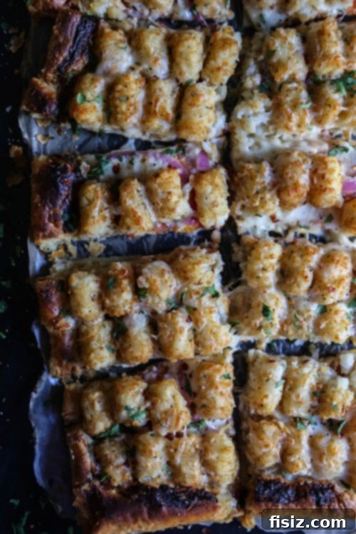 Flaky Puff Pastry Pizza with Cheesy Tater Tot Crunch 5 Close-up of Cheesy Tater Tot Pizza with Fresh Basil