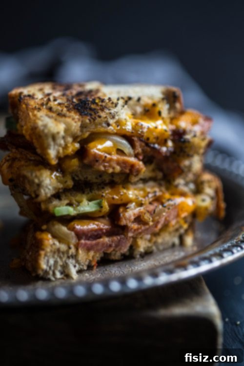 Spicy Andouille and Pimento Grilled Cheese 5 Close-up of a golden Pimento Grilled Cheese with Andouille, perfectly toasted