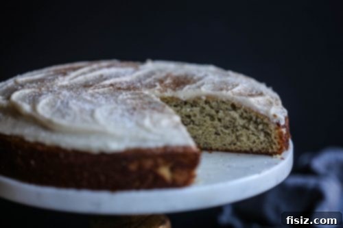 Chai-Spiced Banana Bliss Cake 4 Slice of Banana Cake with Chai Vanilla Frosting on a plate