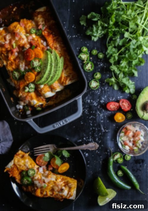 Spicy Chicken Chorizo and Jalapeño Breakfast Enchiladas 6 Overhead shot of a full baking dish of Chicken Chorizo & Jalapeño Breakfast Enchiladas, beautifully garnished and fresh from the oven.
