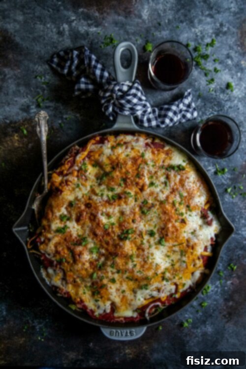 Ultimate Million Dollar Cheeseburger Spaghetti 2 Delicious Million Dollar Cheeseburger Spaghetti served in a bowl, showcasing vibrant layers of cheese, pasta, and meat sauce.