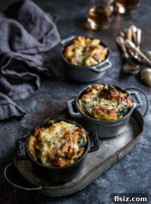Mini Bacon Spinach and Artichoke Challah Bread Puddings 5 Overhead shot of Mini Bacon Spinach Artichoke Challah Bread Puddings on a wooden board