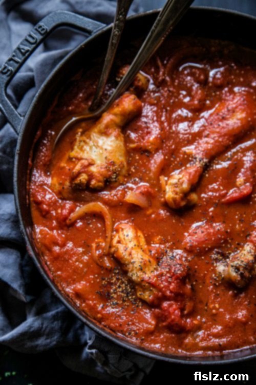 Authentic Haitian Chicken 5 Haitian Chicken simmering in a Dutch oven