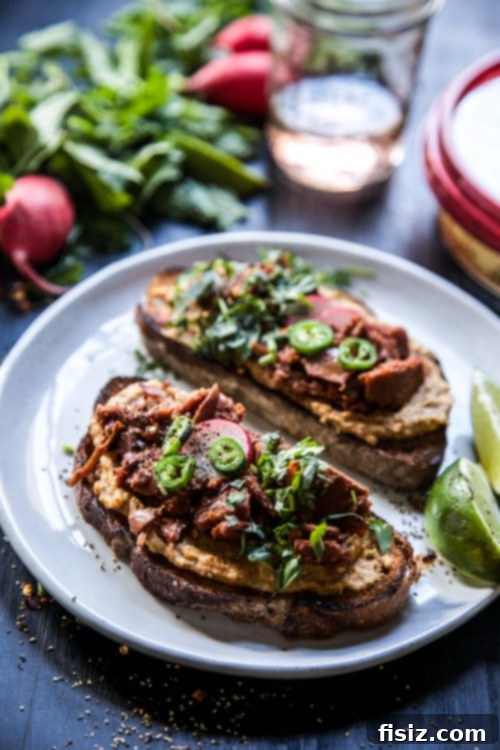 Herbed Chipotle Jackfruit Hummus Toast 8 Finished Chipotle Hummus Jackfruit Toast with Fresh Herbs, ready to serve