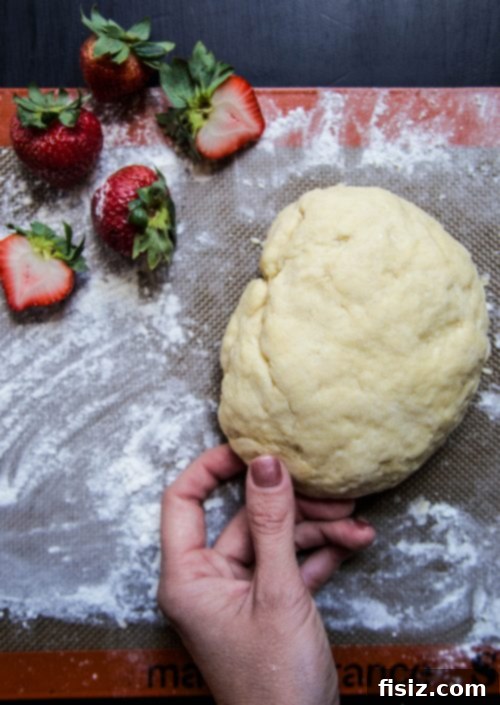 Fresh strawberries and ingredients for homemade cinnamon rolls
