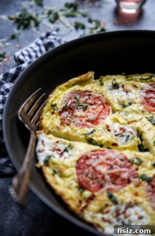 Margherita Frittata Bake 5 An array of fresh garden produce, including ripe tomatoes and green vegetables, hinting at the joy of farm-to-table cooking.