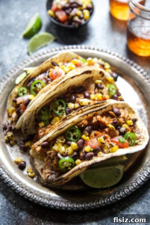 Tender Slow Cooker BBQ Chicken Tacos with Bright Texas Caviar 6 Shredded BBQ Chicken ready for tacos