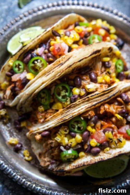 Tender Slow Cooker BBQ Chicken Tacos with Bright Texas Caviar 7 Slow Cooker BBQ Chicken Tacos with Texas Caviar - close up