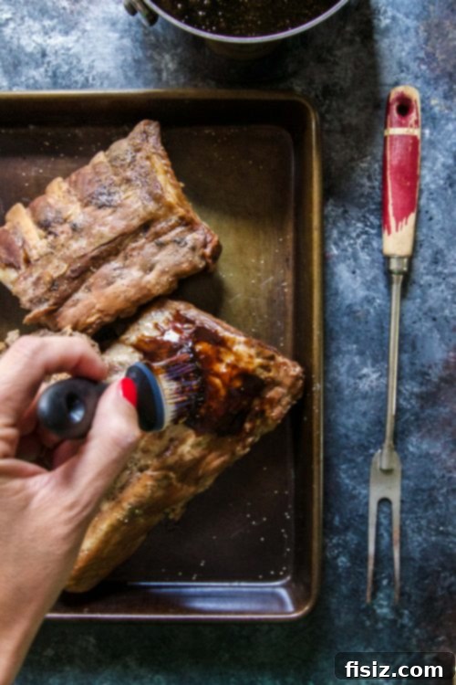 Close-up of slow-cooked baby back ribs ready for glazing