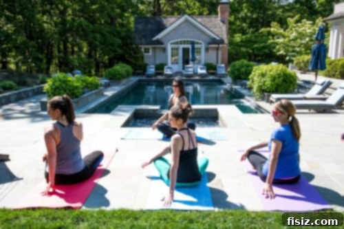Experience New York City and The Hamptons Your Ultimate Guide 15 Group doing yoga by the pool in the Hamptons