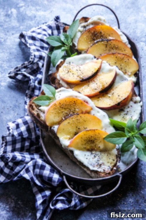 Sweet and Savory Grilled Peach Blue Cheese Toast 6 Whipped blue cheese being spread on a piece of toast