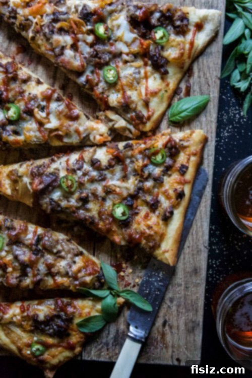 Slow Cooked Sriracha Beef Short Rib Kimchi White Pizza 4 Overhead shot of Slow Cooker Sriracha Beef Short Rib & Kimchi White Pizza on a wooden board