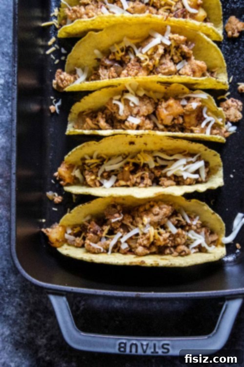 Tangy Al Pastor Chicken Tacos with Blistered Shishito Salsa 4 Close-up of Al Pastor chicken filling with pineapple chunks