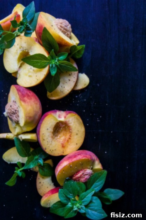 Crispy Bacon and Juicy Peach Sheet Pan Nachos with Zesty Basil-Lime Aioli 3 Fresh peaches on a cutting board, ready for Sheet Pan Nachos