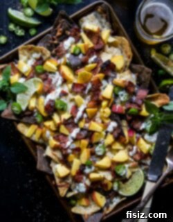 Crispy Bacon and Juicy Peach Sheet Pan Nachos with Zesty Basil-Lime Aioli 6 Final plated Sheet Pan Bacon and Peach Nachos