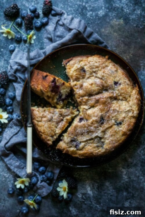Cardamom Kissed Berry Tahini Cake 2 A beautifully sliced Blueberry and Blackberry Tahini Cake with fresh berries