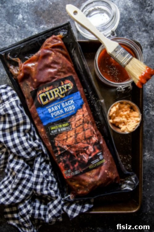 Bacon-Topped Pimento Cheese Glazed BBQ Ribs 3 Tailgate spread with BBQ Pimento Cheese Glazed Ribs and other snacks