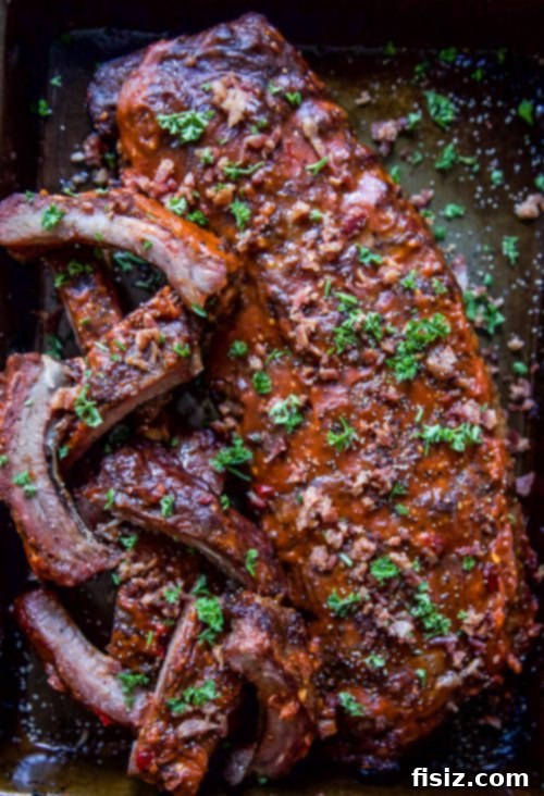 Bacon-Topped Pimento Cheese Glazed BBQ Ribs 5 Brushing BBQ Pimento Cheese glaze onto ribs before baking