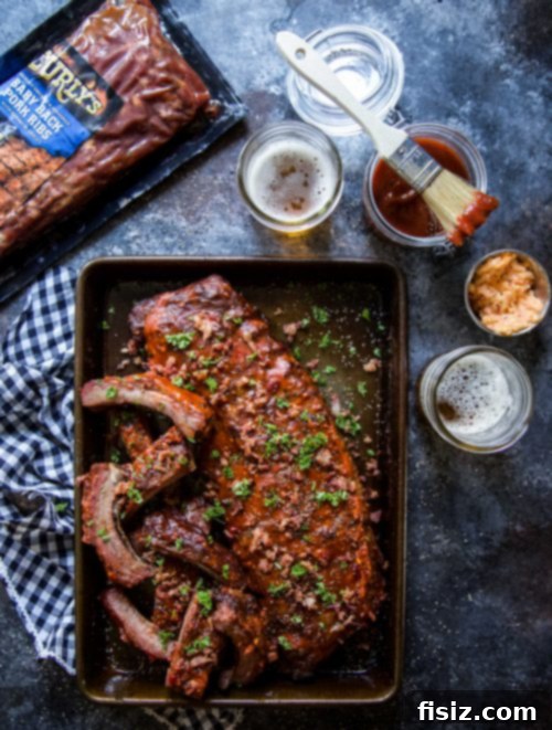 Bacon-Topped Pimento Cheese Glazed BBQ Ribs 6 Basket of BBQ Pimento Cheese Glazed Ribs with Crispy Bacon and parsley garnish