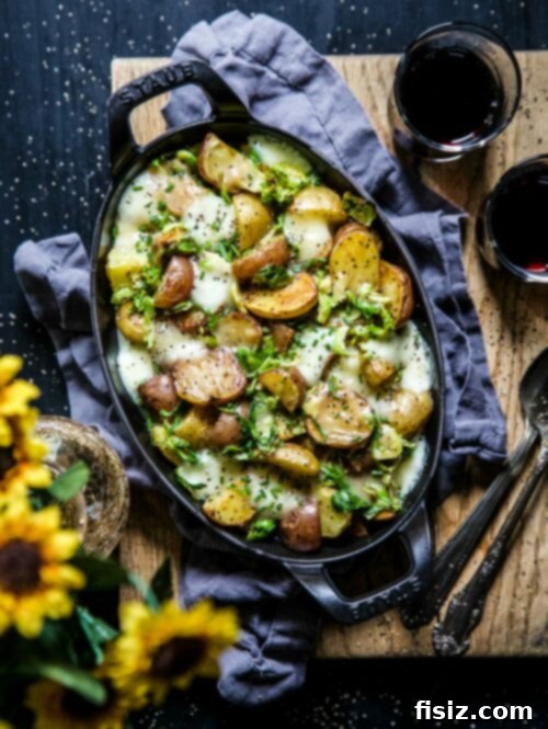 Golden Spud & Sprout Poutine 2 Delicious Roasted Baby Potato Brussels Sprout Poutine served in a white bowl