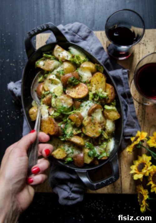 Golden Spud & Sprout Poutine 4 Overhead view of Roasted Baby Potato Brussels Sprout Poutine with fresh chives garnish.