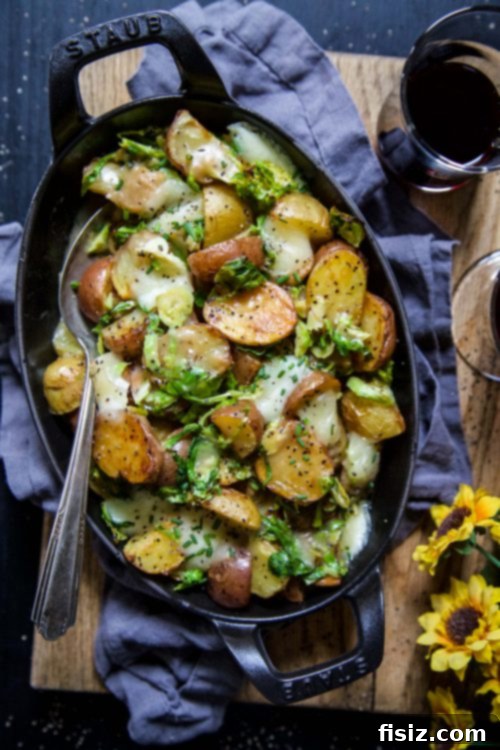 Golden Spud & Sprout Poutine 5 Assembled Roasted Baby Potato Brussels Sprout Poutine, ready to be served, showing the layers of ingredients.