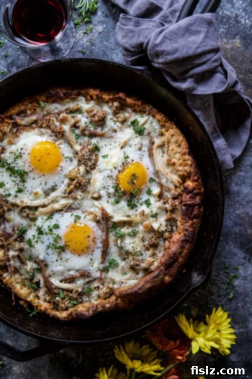 Post-Thanksgiving Dutch Baby Pizza 3 Chef's hands placing Thanksgiving leftovers on a Dutch Baby base