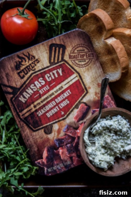 Close-up of a Brisket Burnt Ends Grilled Cheese Sandwich showing melted cheese
