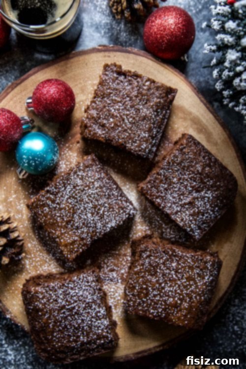 A charming pile of Gingerbread Stout Squares, perfectly baked and ready for holiday serving
