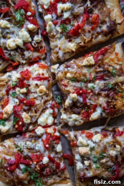 Piquant Four Cheese Pimiento Pizza 4 Four Cheese Spiced Pimiento Pizza, freshly baked and ready to be sliced, highlighting the crispy crust and melted toppings