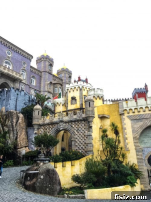 Lisbon Revealed: Your Guide to Stays, Bites, and Sights 45 The colorful and iconic Pena Palace standing majestically on a hilltop