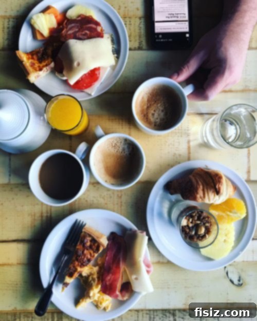 Lisbon Revealed: Your Guide to Stays, Bites, and Sights 8 Breakfast buffet spread with various Portuguese pastries and fresh fruit