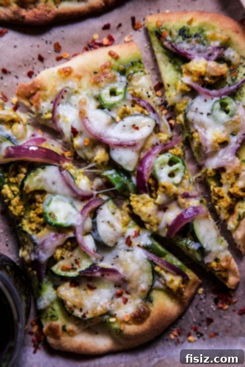 Masala Turkey Pizza 5 Indian Spiced Turkey Pizza with fresh cilantro garnish, sliced and ready.