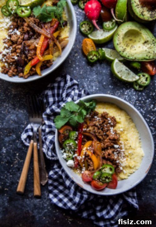 Hearty Spiced Lamb Tamale Bowls 4 Close-up of Spiced Lamb Tamale Bowls with colorful toppings