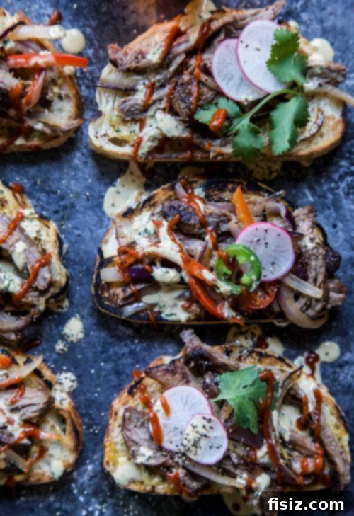 Thai Steak Bites with Zesty Lemongrass Aioli 4 Overhead view of several Thai Steak Toasts arranged on a serving platter, ready to be enjoyed.
